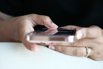 close up of women hand holding smart phone 