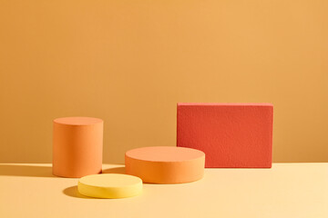 Podiums of different sizes are displayed on a pastel background. Minimalist space for product display with front view. Scene to show cosmetic products.