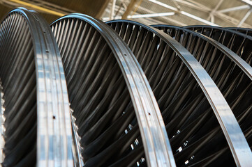 Shiny blades of high-speed steam turbine in workshop © nordroden