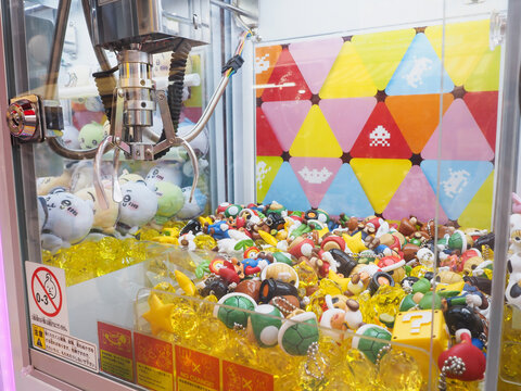 TOKYO, JAPAN - October 29, 2023: A Claw Crane game containing Nintendo Mario goods. It's at a games center in Tokyo.