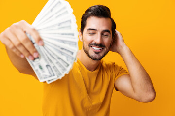 Man rich hand happy cash money background surprised currency yellow business dollar smiling finance