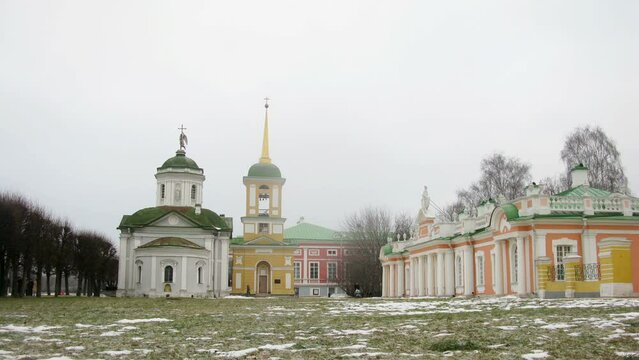 People walk near Kuskovo Estate, Church and Bell Tower