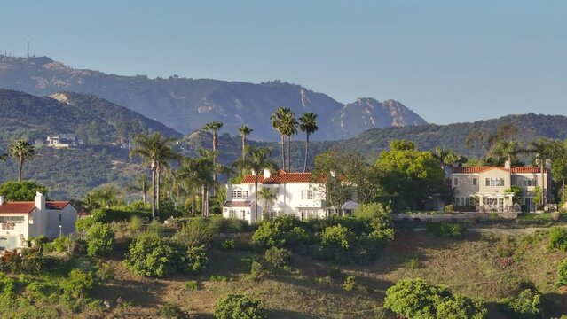 Drone flying over Calabasas hills in San Fernando valley, Los Angeles suburban, California, USA. Overhead shot of luxury Calabasas community surrounded picturesque Santa Monica mountains, 4k footage