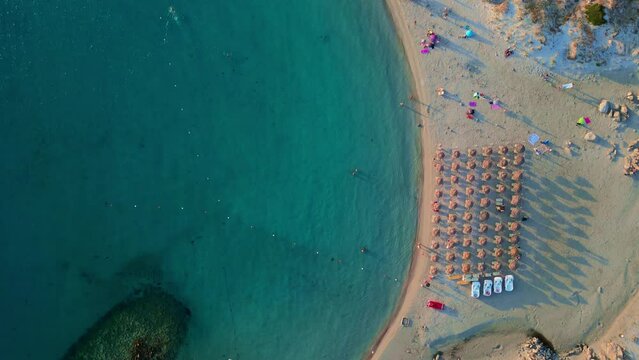 Flying above the crystal clear turquoise water of Punta Molentis Beach, Sardinia