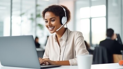 Smiling professional with headset at modern office workspace, ideal for customer service themes. - obrazy, fototapety, plakaty