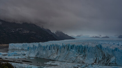 
The impressive Perito Moreno Glacier stretches between the mountain slopes to the horizon. A wall...