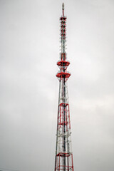 Fragment of a mast with a transmitting TV antenna.on a winter day