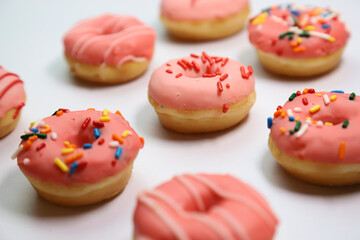 Close up Assorted Strawberry Glazed Donuts 