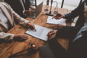 A lawyer, investor, businessman, entrepreneur is reviewing a business contract or insurance contract for future benefits or a businessman signs a document and receives a loan to start a new business. - obrazy, fototapety, plakaty