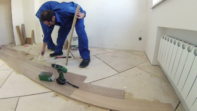 Workers were laid the parquet floor in room, time lapse