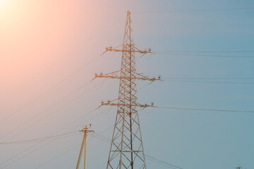 High voltage towers with sky background. Power line support with wires for electricity...