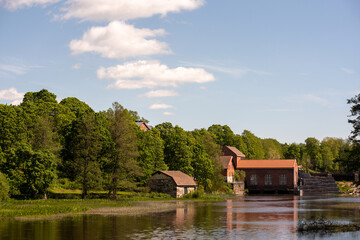 An old red-brick hydroelectric power plant on the river