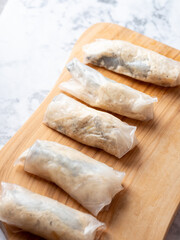 Shrimp dumplings on cutting board