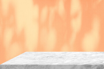 White Marble Table with Tree Shadow on Concrete Wall Texture Background in Peach Fuzz Color, Suitable for Product Presentation Backdrop, Display, and Mock up.