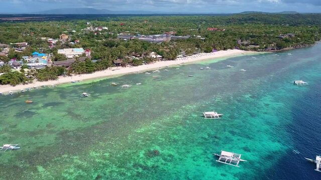 Scenic Aerial Panorama Drone Video of the White Sand Beach of Alona Bach in Panglao, Bohol,. Philippines