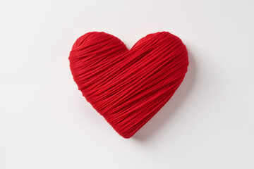 Top view of a red heart made of threads on a white isolated surface. Valentine's Day concept. Generative AI