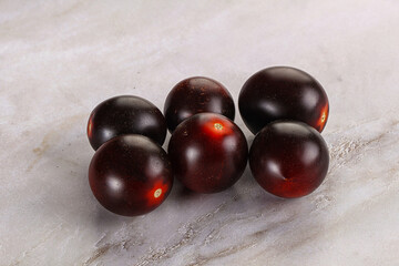 Raw ripe black kumato tomato