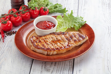 Grilled pork steak with ketchup