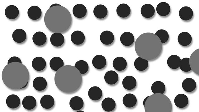 Brownian motion of black and gray circles simulating atoms when viewed under an electron microscope.