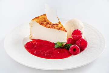 cheesecake with ice cream and sauce
