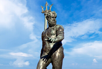 Famous statue of Neptune with trident. Fountain of Neptune in Bologna. Italy. - obrazy, fototapety, plakaty