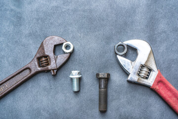 Wrench, hex bolt and hex nut on leather floor. - 695222395