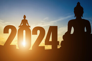 Happy New Year Numbers 2024, Silhouette Buddha statue and Silhouette woman practicing yoga early morning sunrise over the horizon background,Happy new year concept,vivid Twilight dramatic sunset.