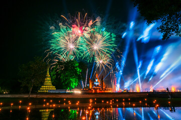 Beautiful Firework scene light color Sukhothai Co Lamplighter Loy Krathong Festival party at The Sukhothai Historical temple park covers the ruins of Sukhothai, in what is now Northern Thailand.