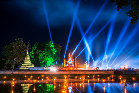 Beautiful scene of The light color Sukhothai Co Lamplighter Loy Kratong Festival at The Sukhothai Historical Park covers the ruins of Sukhothai, in what is now Northern Thailand.