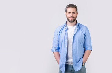 Fototapeta premium mature man with stubble isolated on grey background with copy space. mature man