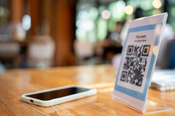 smartphone to scan QR code for order menu in cafe restaurant with a digital delivery. Choose menu...