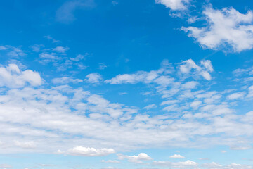 Clear blue sky and white clouds Beautiful white clouds in the clear blue sky, like nature. The...