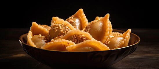 Indian sweet dumplings called Gujiya are traditionally made for the Holi Festival. © TheWaterMeloonProjec