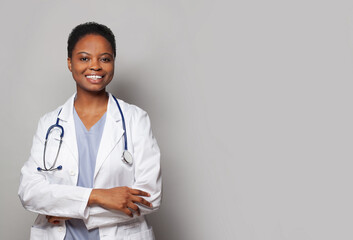 Confident happy doctor woman medical worker in lab coat on white background