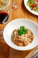 pasta in tomato sauce with beef and parmesan cheese