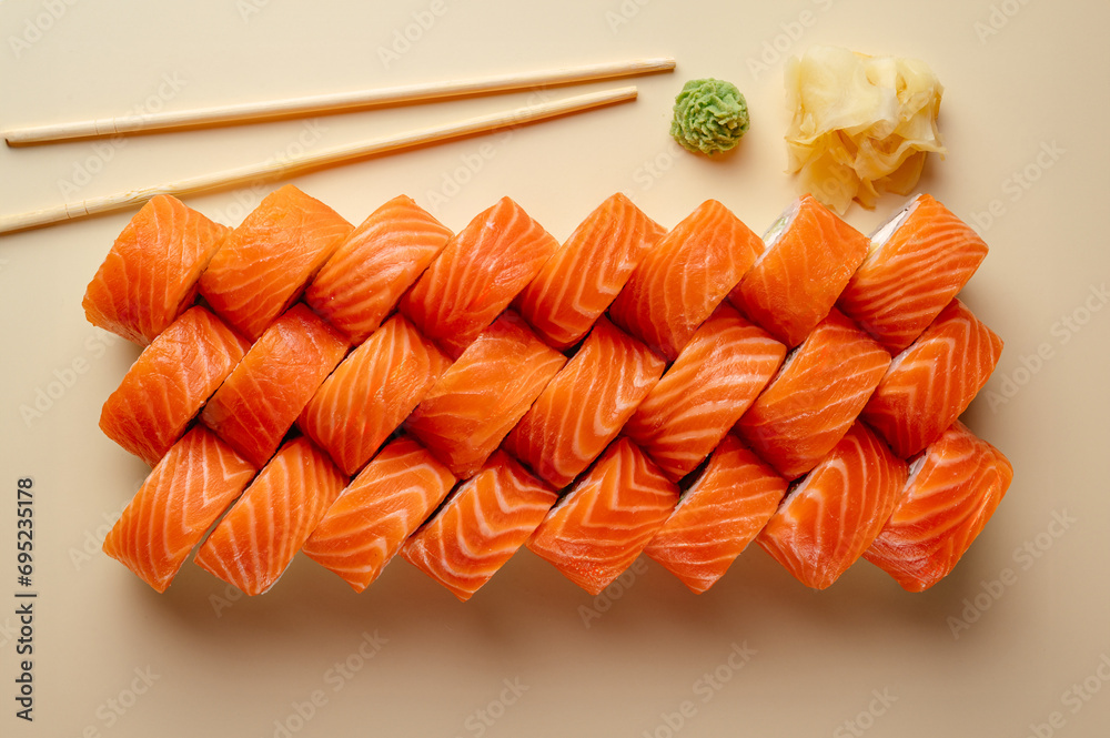 Wall mural Japanese sushi set on a colored background