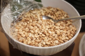 the plate contains refried beans and a spoon ready to eat