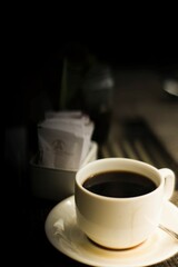 a cup of coffee on the table can be a symbol of warmth in the morning.