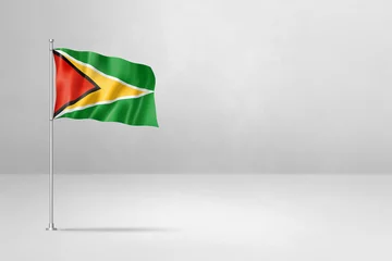 Fotobehang Guyanese flag isolated on white concrete wall background © daboost