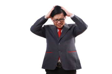 Stressed asian businessman standing while holding his head, suffering from headache. Isolated on white