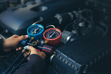 Car maintenance and service Auto mechanic Use a manifold gauge. Check refrigerant and refill car...