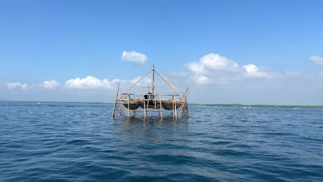 Medium shot of the Bagan structure in the ocean used for night fishing in the Indian Ocean near Muncar village, East Jawa, Indonesia