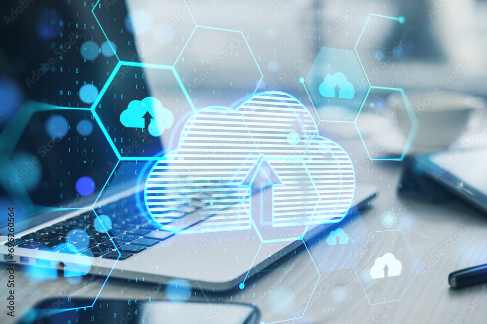 Poster Close up of laptop, smartphone and supplies at desk with glowing hexagonal cloud computing hologram and binary coding on blurry background. Safety and internet concept. Double exposure.