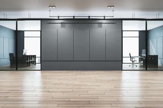 Modern office corridor with mock up place on concrete wall, wooden flooring, windows with city view and reflections. 3D Rendering.