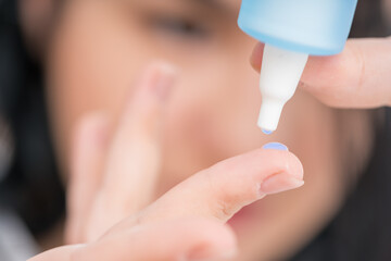 woman using medical drops