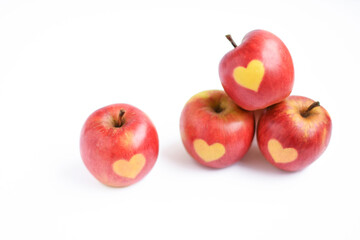 Fototapeta na wymiar Fresh red apples with heart shape on it isolated on white background, healthy eating, health, holiday concept, copy space