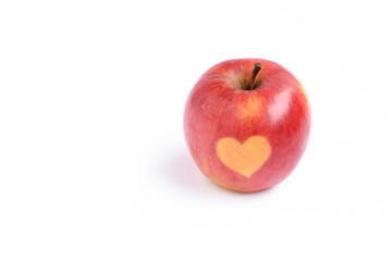 Fresh red apple fruit with heart shape on it isolated on white background, healthy eating, health, holiday concept, copy space