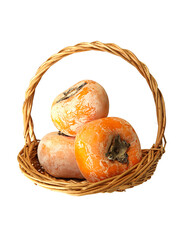 A basket of fruit persimmons with white background
