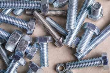 Group of bolts on paper background.