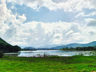 Serene mountain lake. A tranquil lake reflects the towering peaks above, creating a scene of perfect serenity. This image is perfect for use in travel brochures, website backgrounds